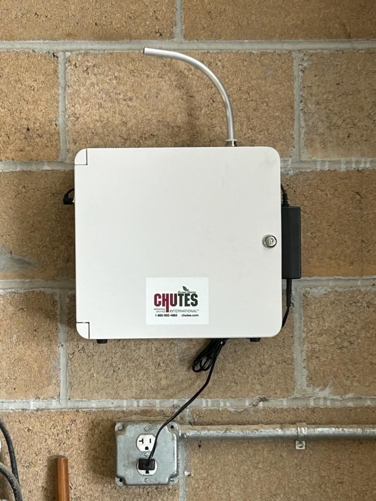 Chutes International compactor control panel installation