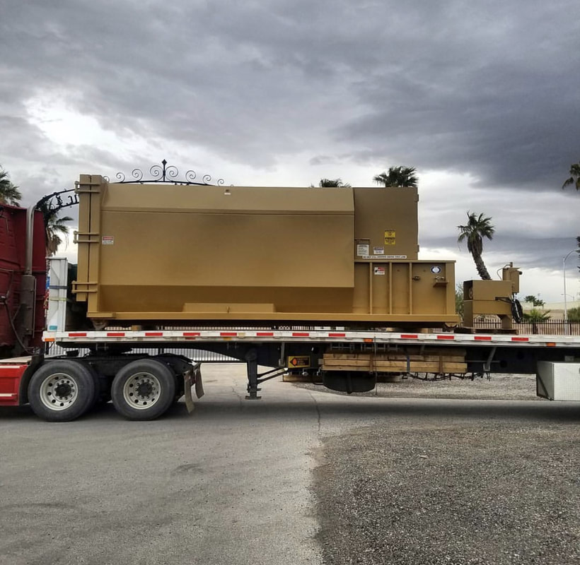 Stationary compactor rental unit at a commercial loading dock